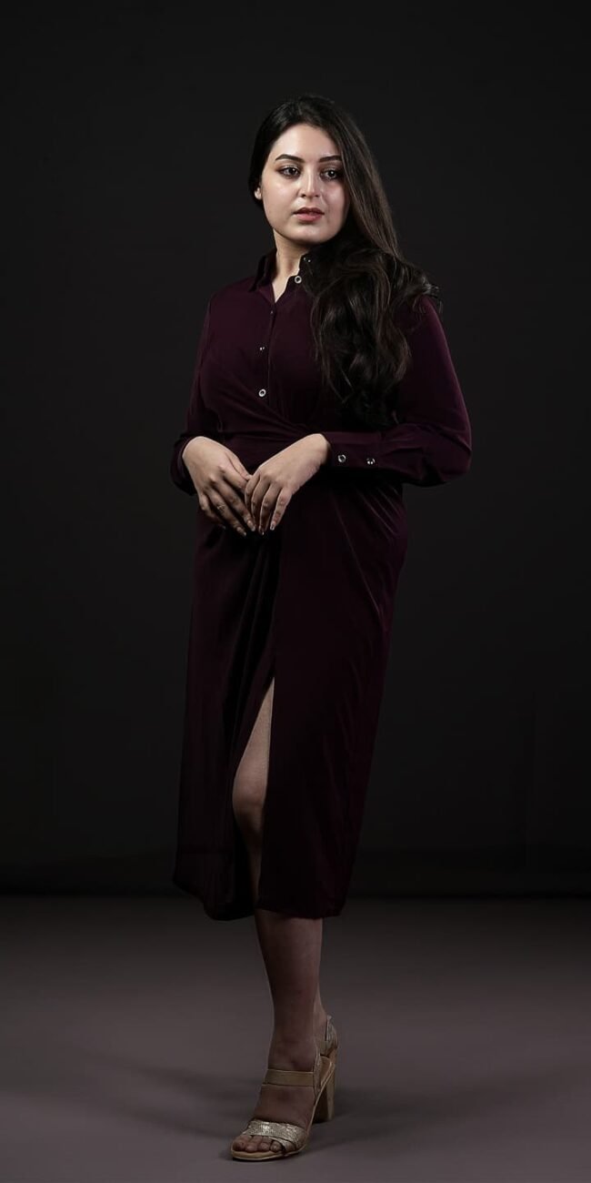 Studio pose with arm over shoulder and soft background